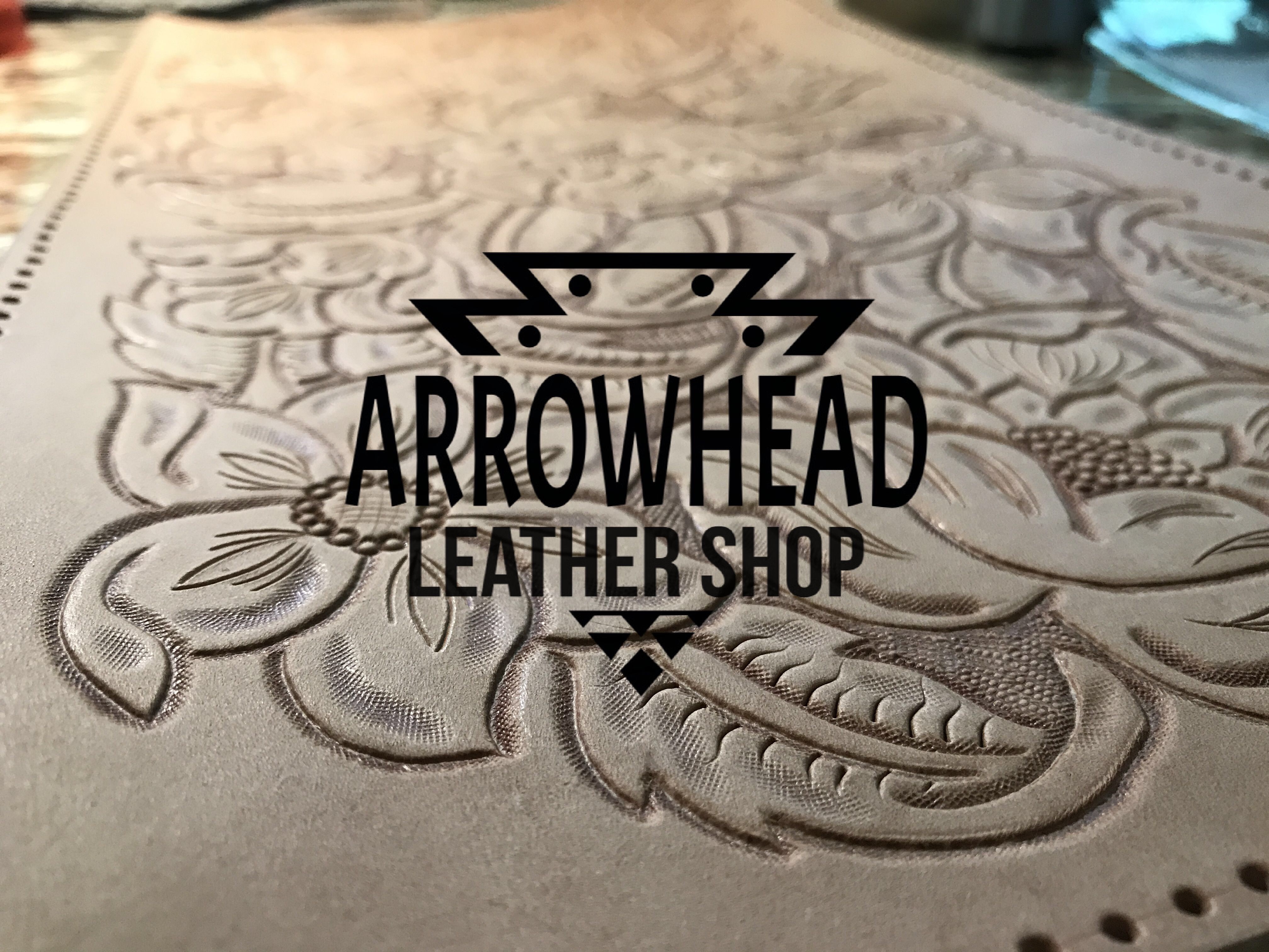 Tooled Leather with Arrowhead Leather Shop's logo